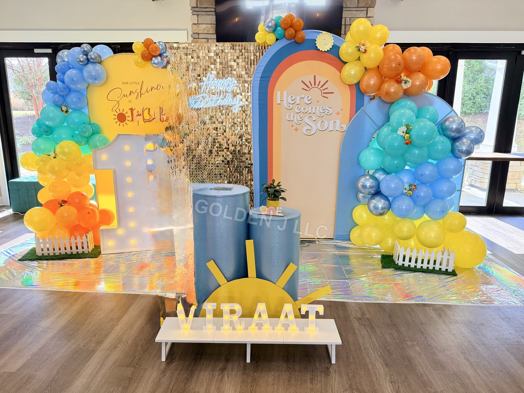 Colorful first birthday balloon installation