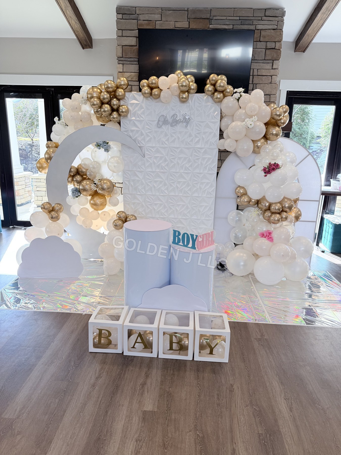 Neutral baby shower backdrop and balloons