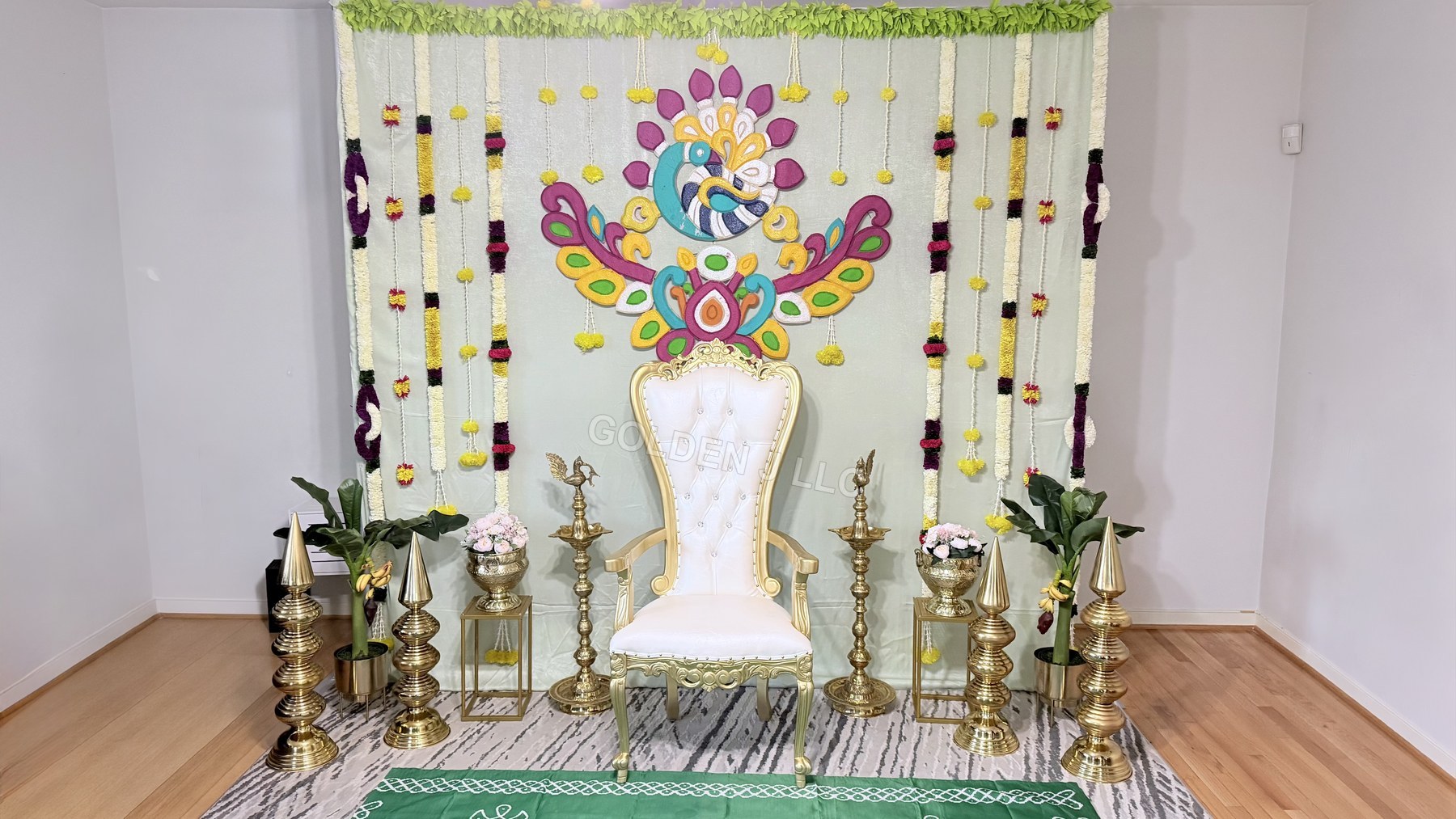 Peacock-themed ceremonial stage with throne seating